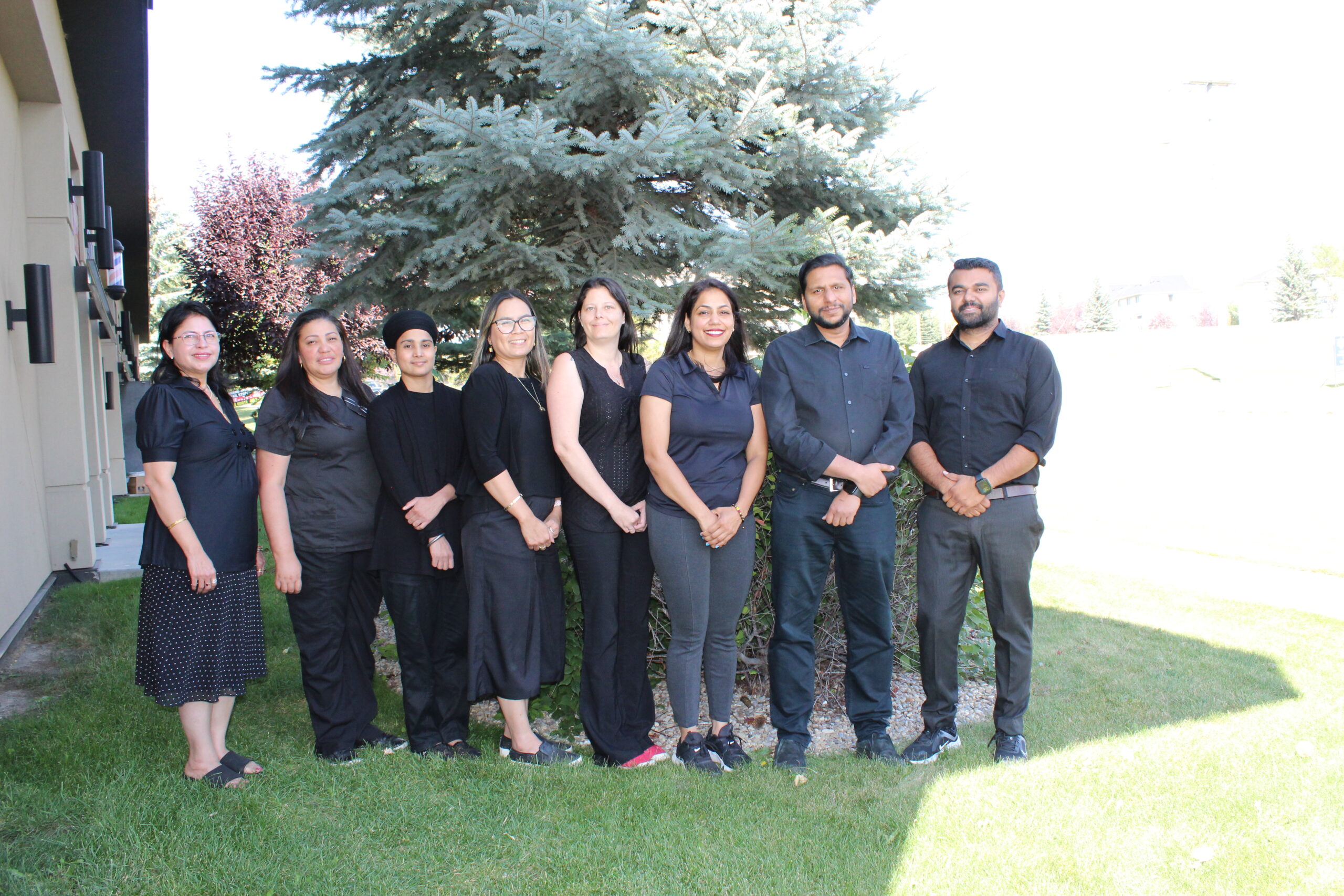 Caring Hands Physiotherapy Country Hills Team Caring Hands Physiotherapy in Country Hills Landing team standing outside the clinic in Calgary